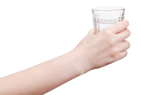 Hand holds mineral water in glass isolated — Stock Photo, Image