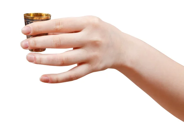 Hand holds little metal cup with spirit — Stock Photo, Image