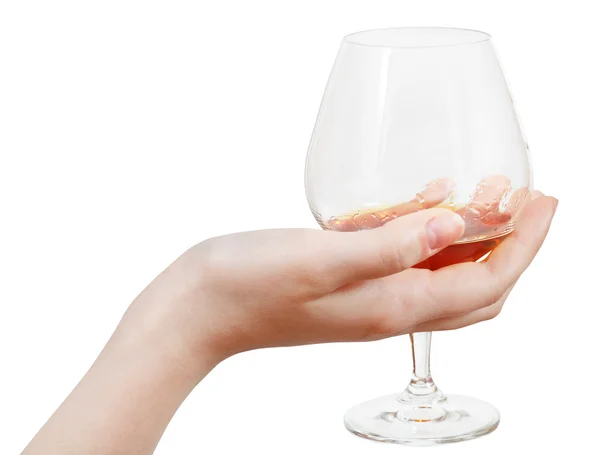 Glass goblet with brandy in hand isolated — Stock Photo, Image