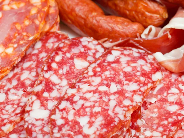 Various sliced meat specialties on plate — Stock Photo, Image