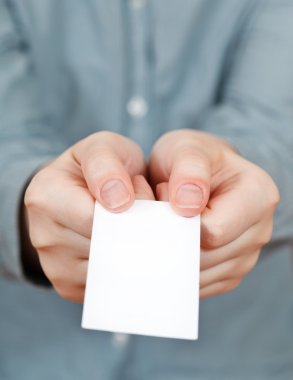blank business card in female hands clipart