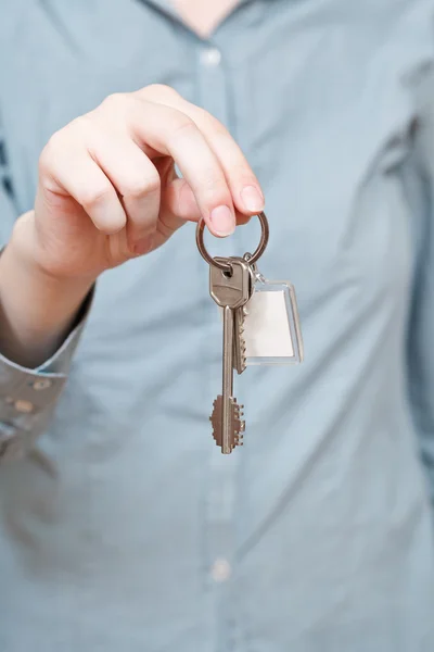 Bunch of door keys with key ring in hand — Stock Photo, Image