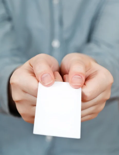 Blank business card in female hands — Stock Photo, Image