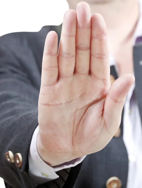 Stoppschild an einer Handfläche - Geste eines Geschäftsmannes — Stockfoto
