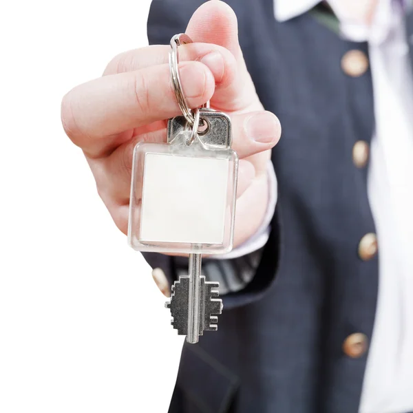 Male hand with blank door key fob close up — Stock Photo, Image