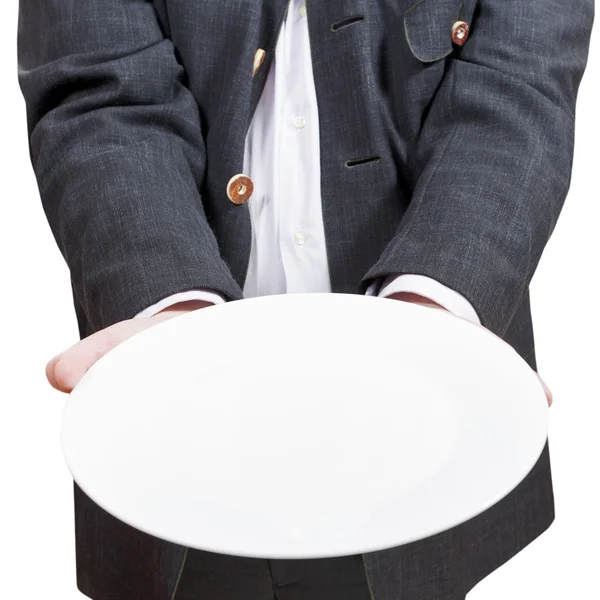 Front view of businessman holds empty white plate — Stock Photo, Image