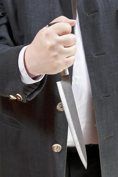 Front view of knife in businessman hand — Stock Photo, Image