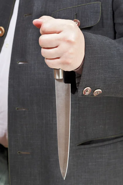 Küchenmesser in der Hand des Geschäftsmannes — Stockfoto