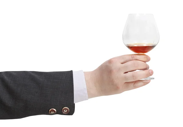 Toast med brandy glas i affärsman hand — Stockfoto