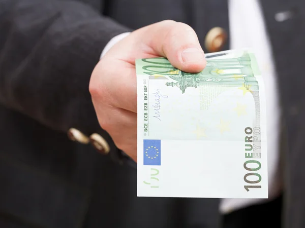 Front view of 100 euro banknote in hand close up Stock Photo