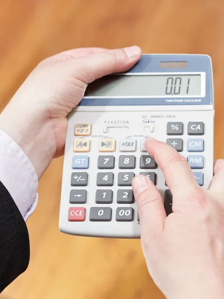 Calculator in businessman hands Royalty Free Stock Photos