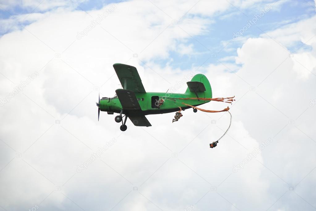 parachuting jump from small green aircraft
