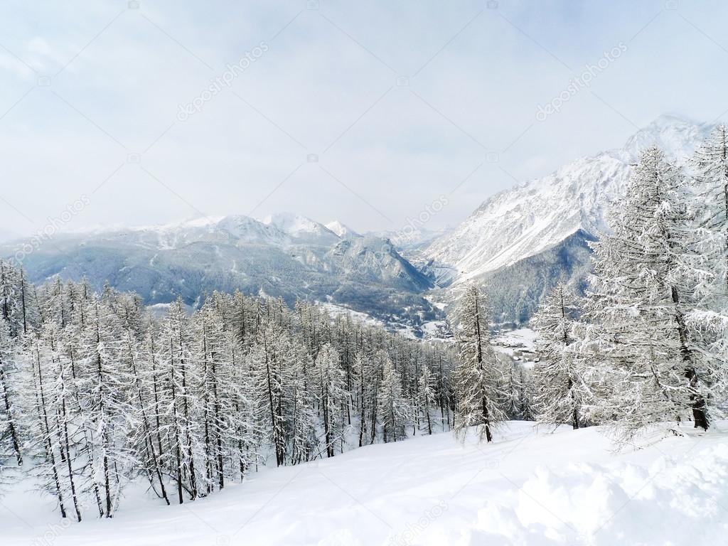 Snow mountain slope in skiing region Via Lattea