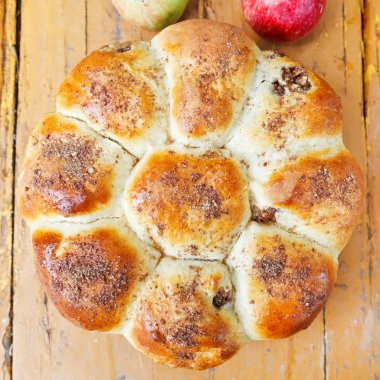 top view of baked closed apple pie and fruits