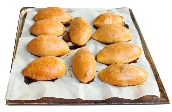 Varios pasteles asados con mermelada de manzana en bandeja — Foto de Stock