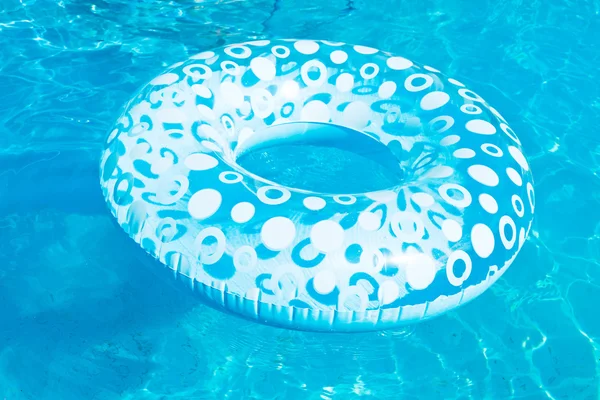 Inflatable swimming circle in blue open-air pool — Stock Photo, Image