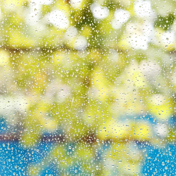 Rain drops on window glass after summer shower — Stock Photo, Image