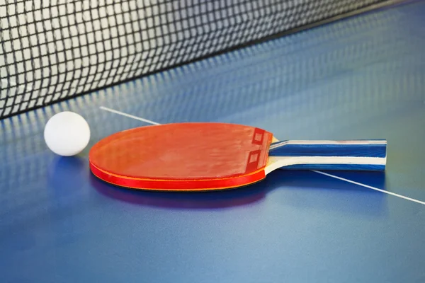 paddle, tennis ball on ping pong sport table