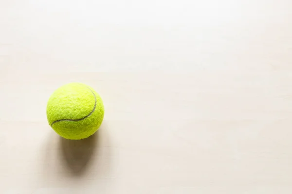 Top View Tennis Ball Light Brown Wooden Board Copyspace — Stock Photo, Image