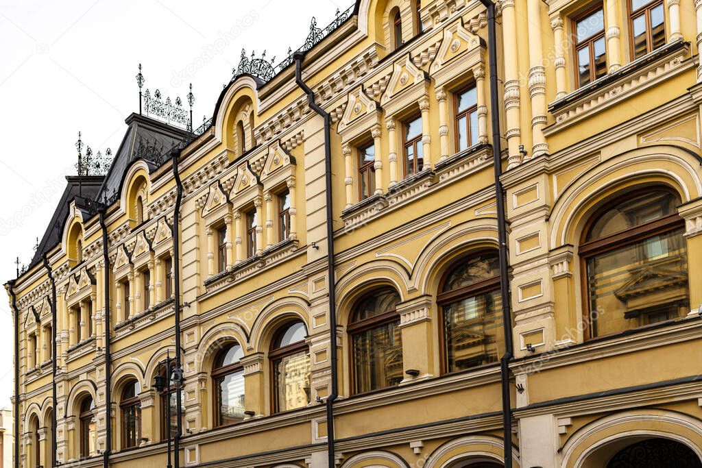 ornamental facade of old urban house on Rozhdestvenka street in Moscow city. This building 9/13 was profitable house of the Tretyakovs built by architect Kaminsky in 1892