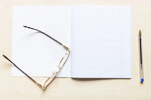 Top View Pen Eyeglasses Blank Open School Notebook Squared Sheets — Stock Photo, Image