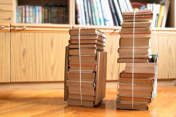 Two Stacks Used Books Tied Packthread Parquet Floor Living Room — Stock Photo, Image