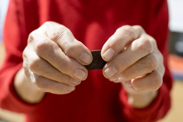 Front View Hands Old Country Woman Holding Chocolate Candy Focus — Stock Photo, Image