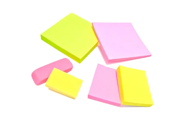 Sticky notes and erasers close-up on white — Stock Photo, Image