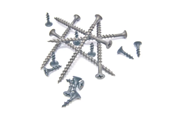 Different black screws on white Stock Picture