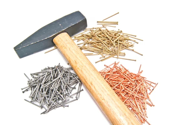 Wooden hammer and different nails — Stock Photo, Image