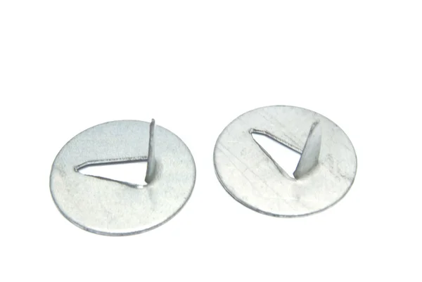 Due pin push color argento in primo piano sul bianco — Foto Stock