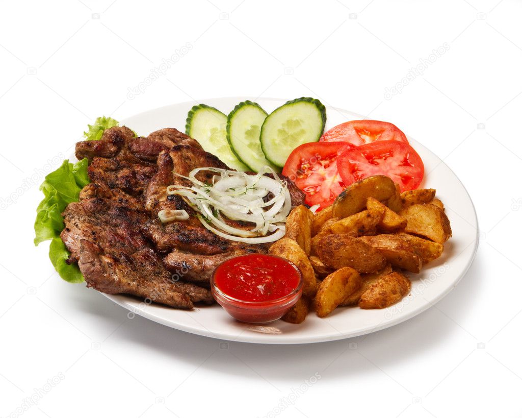 fried spare ribs with potatoes and vegetables