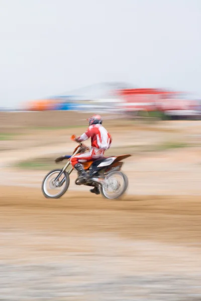 Fast moving motorcyclist, motion blur — Stock Photo, Image