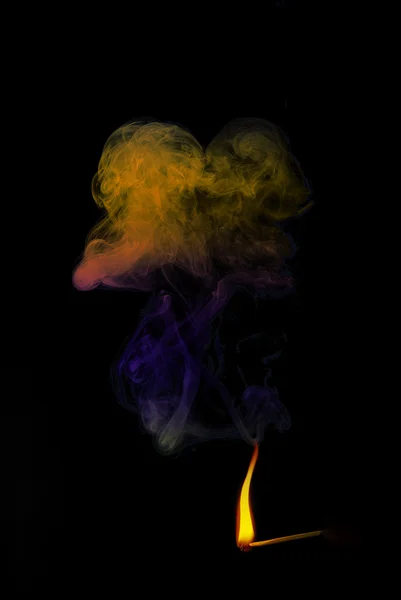 Colorful smoke and yellow flame — Stock Photo, Image