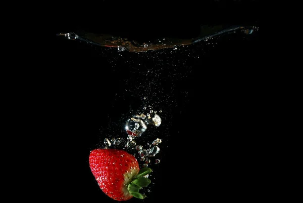 Strawberry in water with bubbles and star — Stock Photo, Image