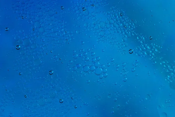 Λίγο λίπος στο μπλε νερό — Φωτογραφία Αρχείου