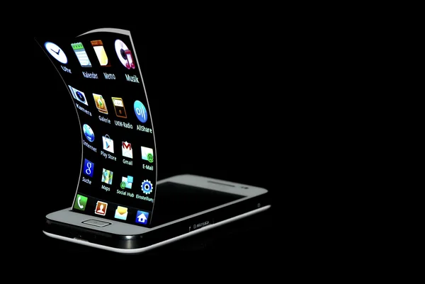 Telefone celular com bordas curvas desktop — Fotografia de Stock