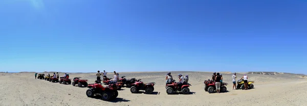 Quad tour in desert panorama — Stock Photo, Image
