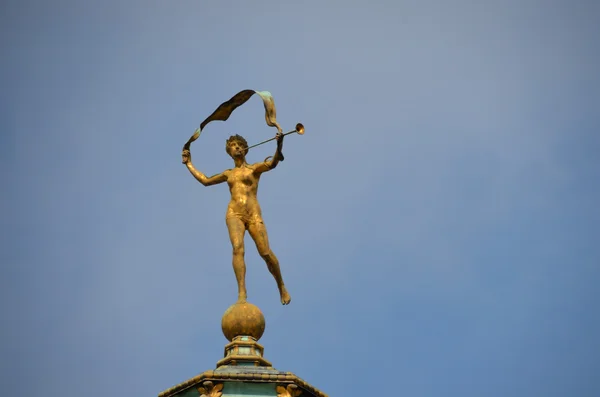 Golden figure on a roof — Stock Photo, Image