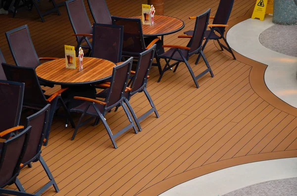 Tables in relaxing area on ship — Stock Photo, Image