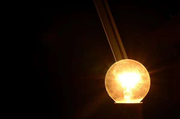 Bulb lights up — Stock Photo, Image