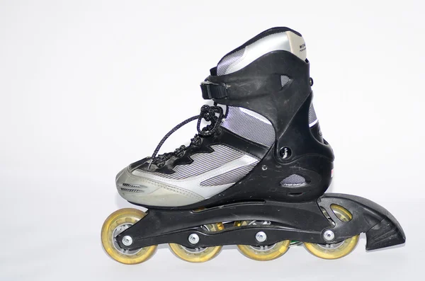 Rollerskates in gray and black on white — Stock Photo, Image