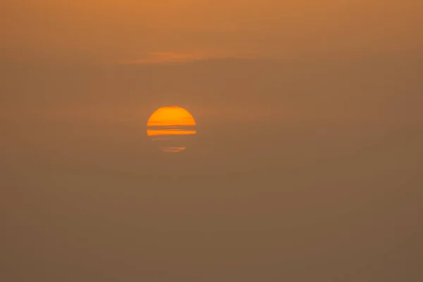 half covered sun during sunrise at the sea in egypt detail view