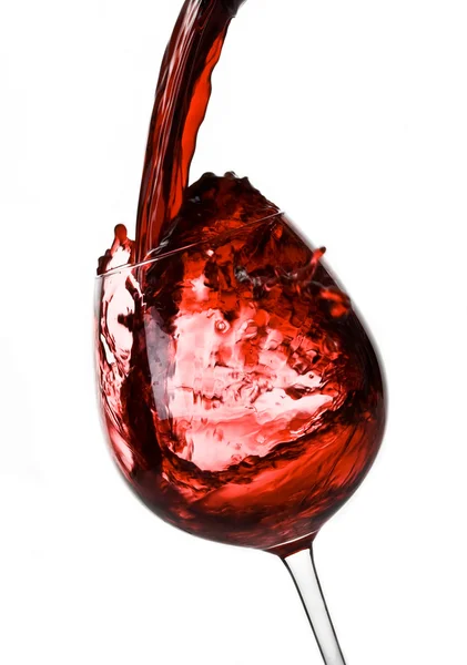 Öntés le egy pohár vörös bor Stock Fotó