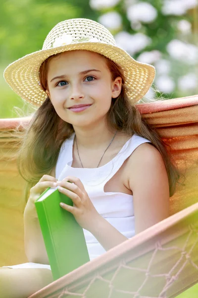 Rest in the garden - lovely girl inl hammock — Stock Photo, Image