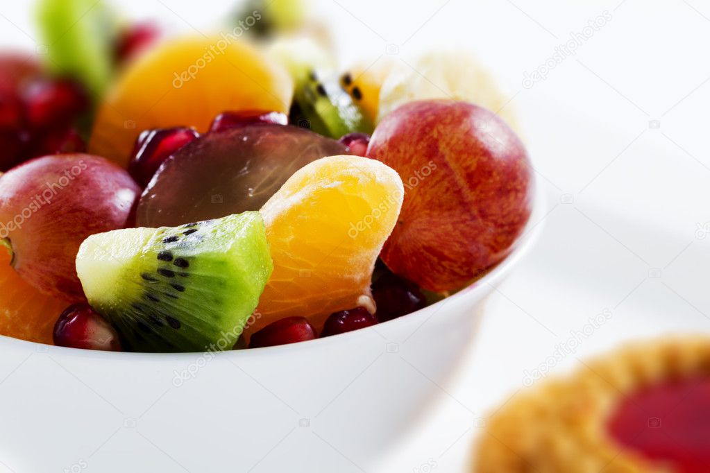 Diet, healthy fruit salad in the white bowl - healthy breakfast