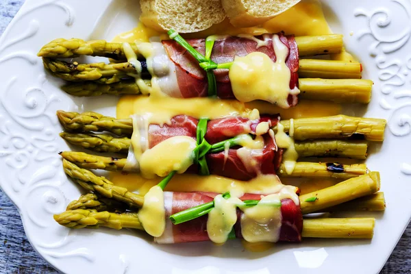 Asparagus - Grilled young asparagus wrapped in prosciutto meat — Stock Photo, Image