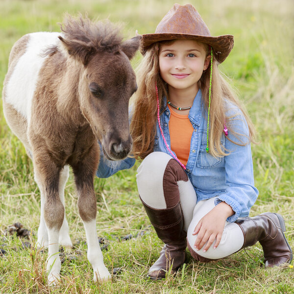 Ranch - Lovely girl with pony on the ranch