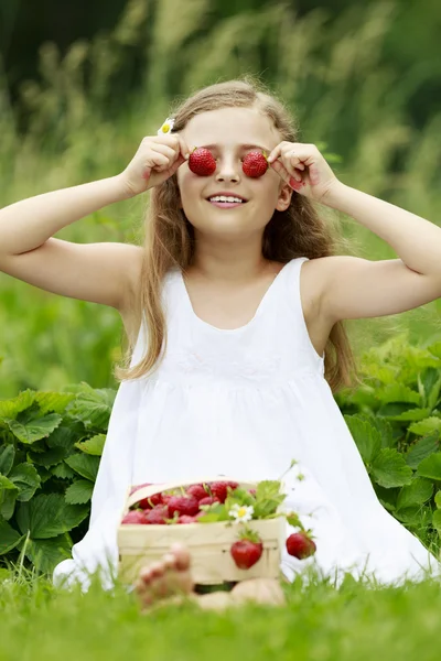 Strawberry time - young girl with picked strawberries — Stock Photo, Image