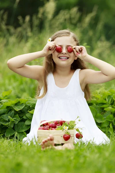 Strawberry time - young girl with picked strawberries — Stock Photo, Image